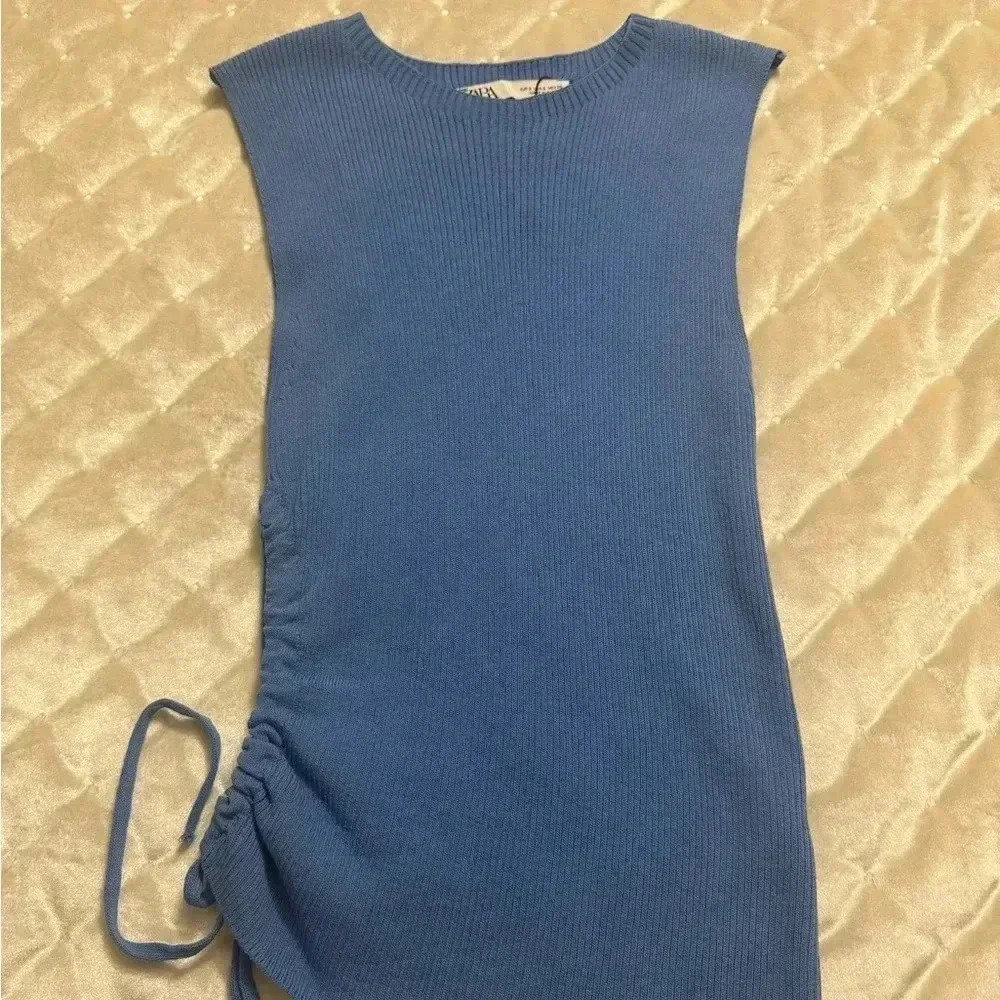 ZARA baby blue top with an open side at the waist and tie